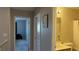 Hallway with an open door into a bedroom and a closed door to a bathroom at 10804 Mason Hill Ave, Las Vegas, NV 89166
