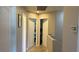 Bright hallway with white doors leading to rooms and a view of the staircase at 10804 Mason Hill Ave, Las Vegas, NV 89166
