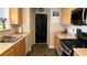 Well-lit kitchen features a gas range, lots of storage, and a large sink at 10804 Mason Hill Ave, Las Vegas, NV 89166