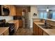 Modern kitchen with stainless steel appliances, a gas range, and ample counter space at 10804 Mason Hill Ave, Las Vegas, NV 89166