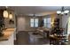 Bright living room with hardwood floors, a sofa, and large windows at 10804 Mason Hill Ave, Las Vegas, NV 89166