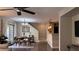 Open-concept living area with hardwood floors, dining table, and kitchen view at 10804 Mason Hill Ave, Las Vegas, NV 89166