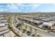 Aerial view of new homes in a planned community near palm tree lined street at 10919 Vista Altura Ave, Las Vegas, NV 89135
