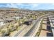 New luxury home community with gate, desert landscaping, and mountain views in the distance at 10919 Vista Altura Ave, Las Vegas, NV 89135