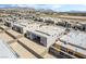 This aerial view captures modern homes in a new development, showcasing their sleek designs and desert surroundings at 10919 Vista Altura Ave, Las Vegas, NV 89135