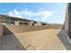 Spacious backyard featuring block wall fencing and dirt landscaping, perfect for creating your dream outdoor space at 10919 Vista Altura Ave, Las Vegas, NV 89135