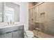 Bathroom featuring an elegant vanity and glass-enclosed shower at 10919 Vista Altura Ave, Las Vegas, NV 89135