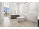 Bright bathroom with a freestanding tub, double vanity, and large windows providing ample natural light at 10919 Vista Altura Ave, Las Vegas, NV 89135