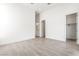 Spacious bedroom featuring tile flooring and a view to the closet at 10919 Vista Altura Ave, Las Vegas, NV 89135