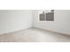 A bright and empty bedroom with a window at 10919 Vista Altura Ave, Las Vegas, NV 89135