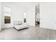 Clean bedroom featuring ample natural light, tile floors, and neutral decor at 10919 Vista Altura Ave, Las Vegas, NV 89135