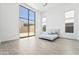 Serene bedroom with floor-to-ceiling windows, neutral decor, and tile floors at 10919 Vista Altura Ave, Las Vegas, NV 89135