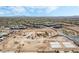 Aerial view of a new home construction site with framing, equipment, and pre-built concrete modules at 10919 Vista Altura Ave, Las Vegas, NV 89135