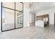 Spacious living room with modern finishes, large windows, and great natural light at 10919 Vista Altura Ave, Las Vegas, NV 89135