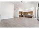 Open-concept space blending kitchen and living with high ceilings and tile flooring at 10919 Vista Altura Ave, Las Vegas, NV 89135