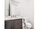 A clean powder room with a vessel sink and a large mirror at 10919 Vista Altura Ave, Las Vegas, NV 89135