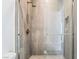 Contemporary shower with a glass door and modern fixtures at 10919 Vista Altura Ave, Las Vegas, NV 89135