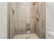 A bright and clean shower with glass door and elegant tile at 10919 Vista Altura Ave, Las Vegas, NV 89135