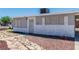 Quaint single-story home with secure windows, stone accents and low maintenance desert landscaping at 1121 W Monroe Ave, Las Vegas, NV 89106