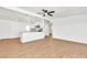 Open-concept living room featuring modern light fixtures and wood-look flooring at 1121 W Monroe Ave, Las Vegas, NV 89106