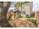Backyard with covered patio, some artificial grass, and block wall at 1135 Paradise Mountain Trl, Henderson, NV 89002