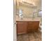 Bathroom features a double sink vanity with white countertops and dark wood cabinets at 1135 Paradise Mountain Trl, Henderson, NV 89002