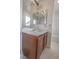 Bathroom features a single sink vanity with white countertops and dark wood cabinets at 1135 Paradise Mountain Trl, Henderson, NV 89002
