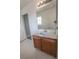 Bathroom featuring a single sink vanity with white countertops and dark wood cabinets at 1135 Paradise Mountain Trl, Henderson, NV 89002