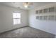 Bedroom featuring carpet flooring, a ceiling fan, and built-in shelving at 1135 Paradise Mountain Trl, Henderson, NV 89002
