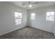Bedroom with neutral carpet and three windows for natural light at 1135 Paradise Mountain Trl, Henderson, NV 89002