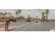 Gated community entrance with palm trees, attractive landscaping, and controlled access at 1135 Paradise Mountain Trl, Henderson, NV 89002