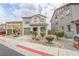 Charming two-story home with landscaped front yard and attached garage at 1135 Paradise Mountain Trl, Henderson, NV 89002