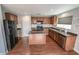 Spacious eat-in kitchen has stainless appliances, an island, and dark countertops at 1135 Paradise Mountain Trl, Henderson, NV 89002