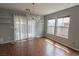Living room with lots of natural light, hardwood floors, and sliding glass doors at 1135 Paradise Mountain Trl, Henderson, NV 89002