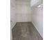 Spacious walk-in closet with carpet flooring and multiple shelves for organized storage at 1135 Paradise Mountain Trl, Henderson, NV 89002