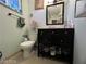 Bathroom features standard toilet and dark wood vanity with sink at 1152 Miller Ave, Las Vegas, NV 89106