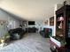 Open-concept living room features tile floors, neutral paint, and a comfortable seating arrangement at 1152 Miller Ave, Las Vegas, NV 89106