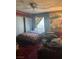 A view of the bedroom with a queen bed, patterned bedding, and neutral toned carpet at 1507 Elizabeth Ave # 1, Las Vegas, NV 89119