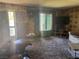 The living room has patterned walls, a large window and two televisions at 1507 Elizabeth Ave # 1, Las Vegas, NV 89119
