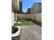 This backyard is fully fenced with gravel and turf at 1891 Via Del Prado St, Las Vegas, NV 89115