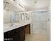This bathroom features dual sinks, a glass shower, and a large mirror at 1891 Via Del Prado St, Las Vegas, NV 89115