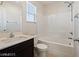 This bathroom has a shower and tub combo, window, and large vanity at 1891 Via Del Prado St, Las Vegas, NV 89115