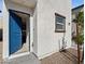Entryway with a blue front door and a small window at 1891 Via Del Prado St, Las Vegas, NV 89115