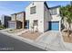Two-story home with a two car garage and a blue entry and garage door at 1891 Via Del Prado St, Las Vegas, NV 89115
