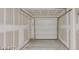 This is the two car garage with drywall and a modern garage door at 1891 Via Del Prado St, Las Vegas, NV 89115