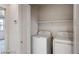 The laundry room features a shelf and a new washer and dryer at 1891 Via Del Prado St, Las Vegas, NV 89115