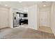 View of the kitchen and front door from the living room at 1891 Via Del Prado St, Las Vegas, NV 89115