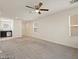 Bright living room with carpet, view of the kitchen and backyard access at 1891 Via Del Prado St, Las Vegas, NV 89115
