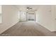 Living room with carpet and sliding door access to the backyard at 1891 Via Del Prado St, Las Vegas, NV 89115