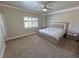 Spacious bedroom features neutral walls, plush carpet, and a unique bed frame with ambient lighting at 210 Magnolia Blvd, Pahrump, NV 89048